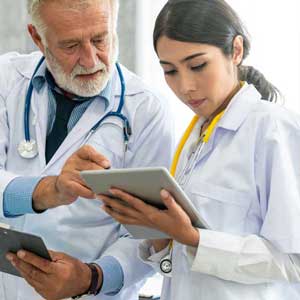 two providers looking a tablet