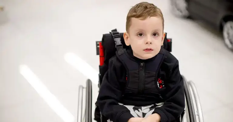 child in wheelchair with catheter pain